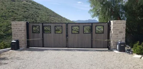 Dual swing driveway gate with automatic openers